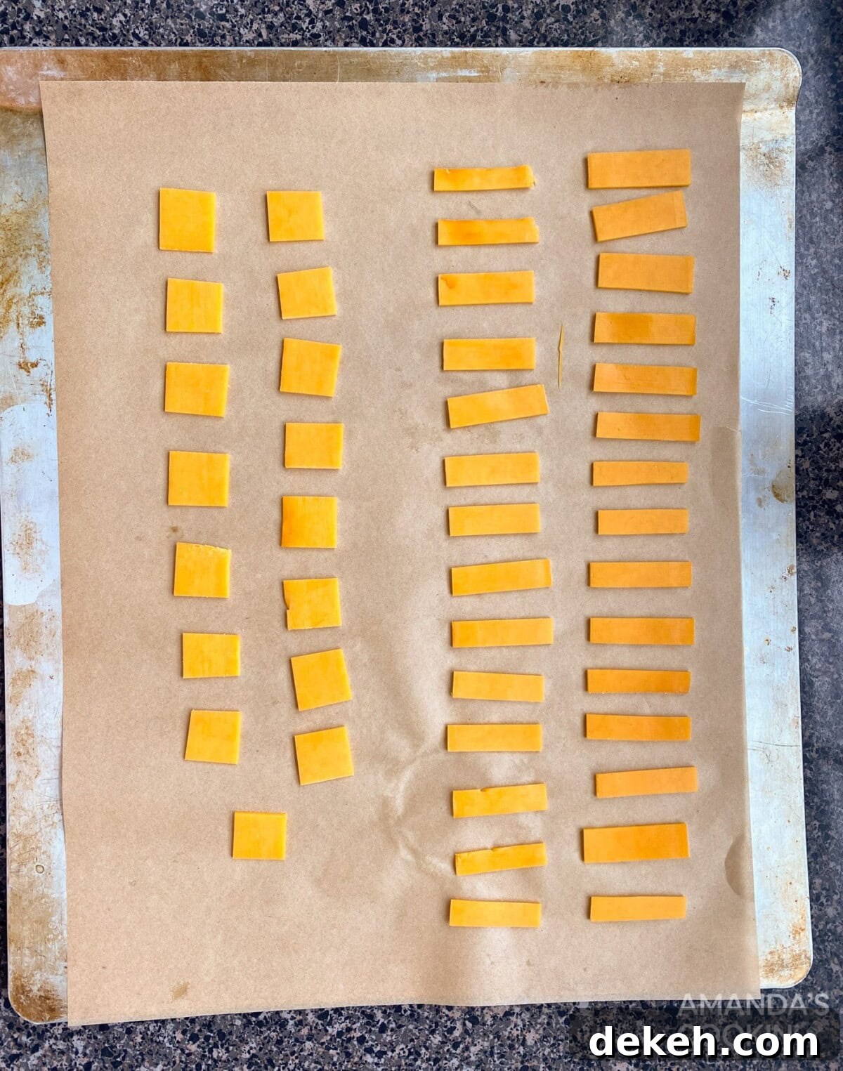cheese pieces on baking sheet