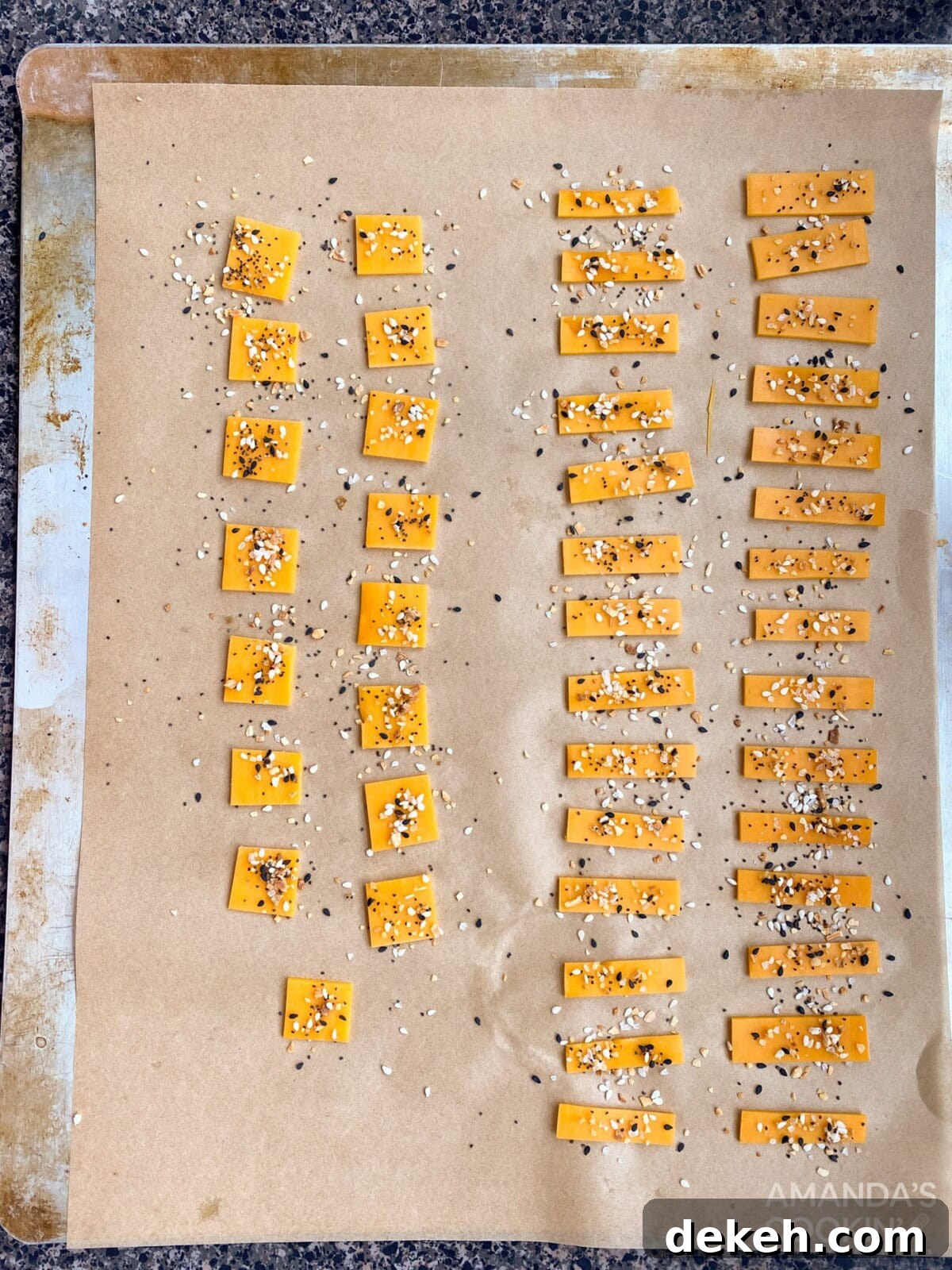 cheese pieces with seasoning on sheet