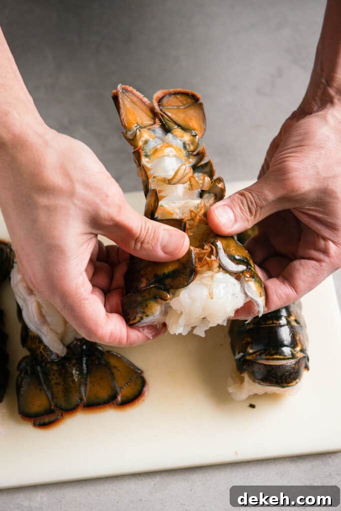 separating lobster tail meat from shell