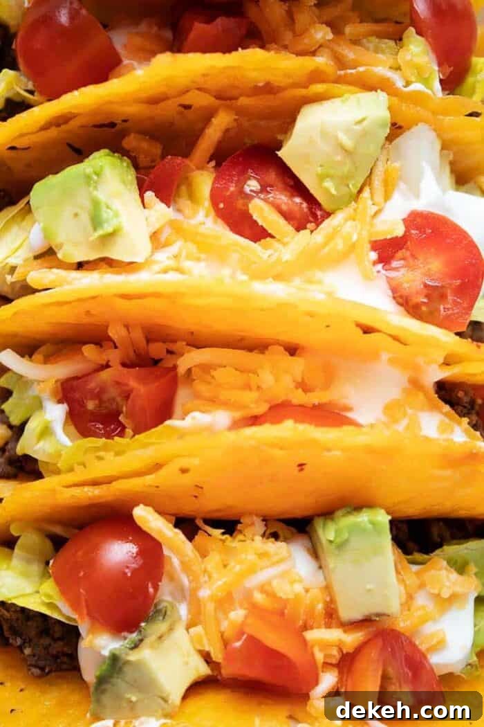 overhead closeup view of keto cheese taco shells filled with taco ingredients