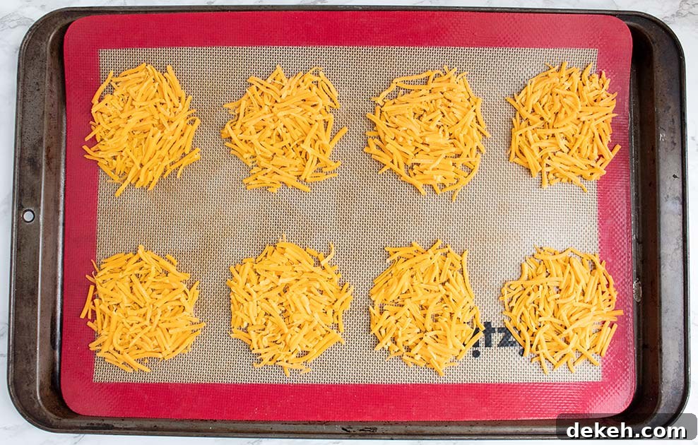 keto taco cups on a silicone baking mat before cooking