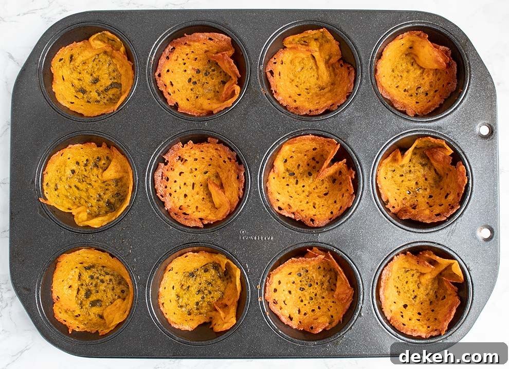 keto taco cups cheese placed inside the cupcake pan