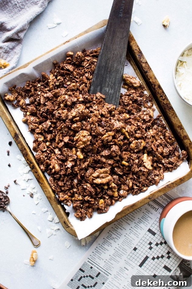 This easy dark chocolate paleo grain free granola is gluten free, dairy free, and packed with all the things you love about granola without any of the grains. Easy to make, good for you, and so freaking delicious. I know it's going to earn a fast spot in your heart and in your kitchen!