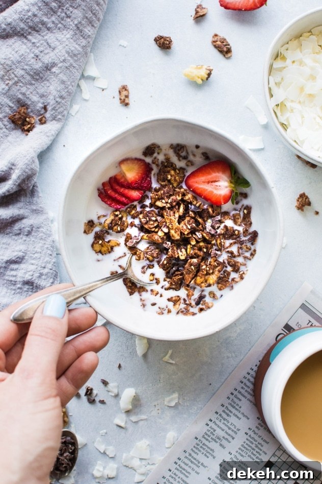 This easy dark chocolate paleo grain free granola is gluten free, dairy free, and packed with all the things you love about granola without any of the grains. Easy to make, good for you, and so freaking delicious. I know it's going to earn a fast spot in your heart and in your kitchen!