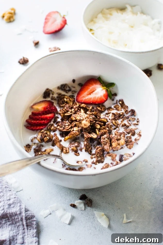 This easy dark chocolate paleo grain free granola is gluten free, dairy free, and packed with all the things you love about granola without any of the grains. Easy to make, good for you, and so freaking delicious. I know it's going to earn a fast spot in your heart and in your kitchen!
