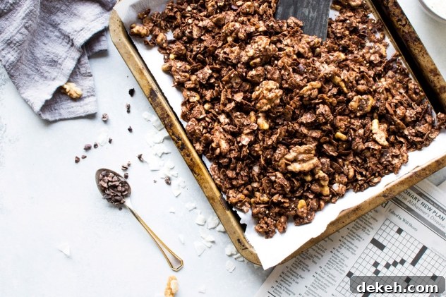 This easy dark chocolate paleo grain free granola is gluten free, dairy free, and packed with all the things you love about granola without any of the grains. Easy to make, good for you, and so freaking delicious. I know it's going to earn a fast spot in your heart and in your kitchen!