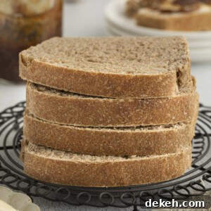 Four slices of sprouted wheat bread stacked on top of each other.