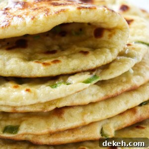 A stack of naan bread made with einkorn flour.