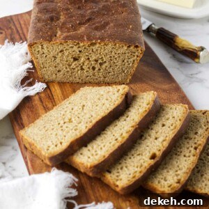 Whole wheat einkorn bread on a cutting board.