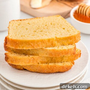 Four slices of sandwich bread made with einkorn flour on a plate.