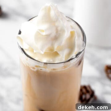 A Starbucks iced white chocolate mocha topped with whipped cream.
