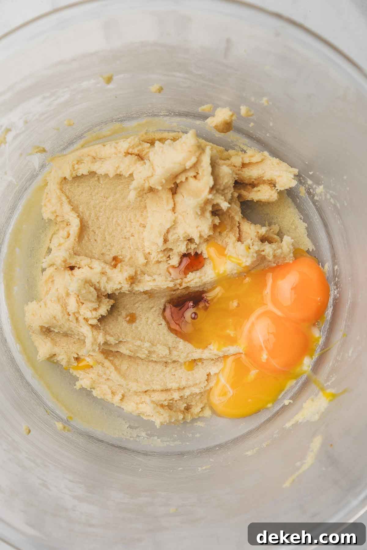 mixing bowl with creamed butter and sugar with egg yolks