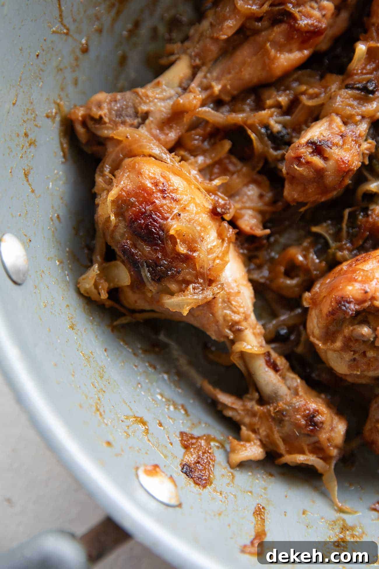 Chicken with caramelized onions in a pan
