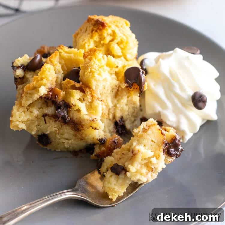 piece of chocolate chip bread pudding on a gray plate