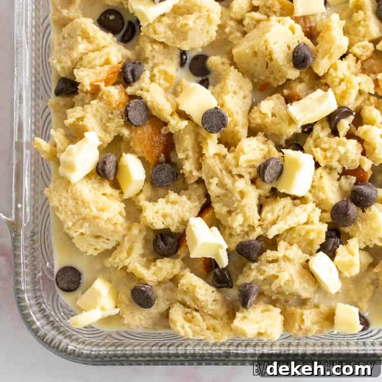 unbaked chocolate chip bread pudding in glass dish