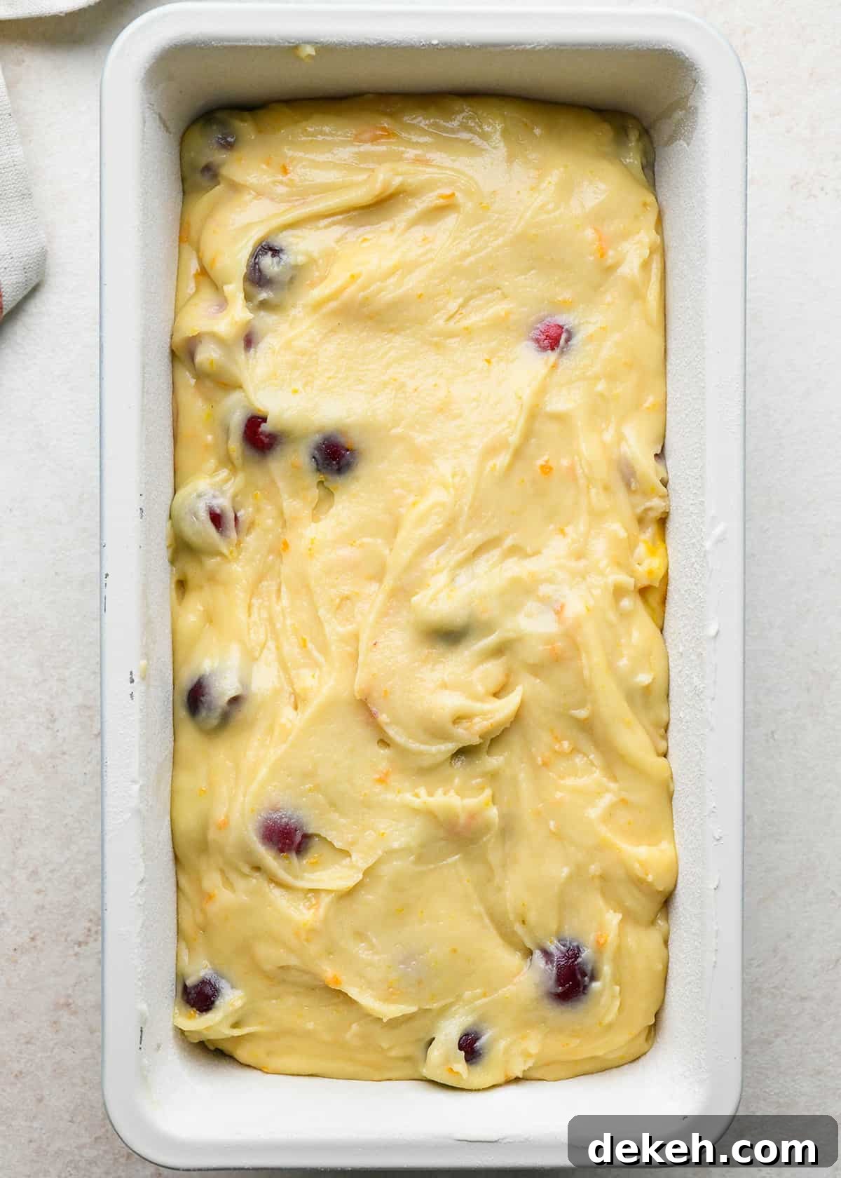 Cranberry Orange Bread in a loaf pan before baking