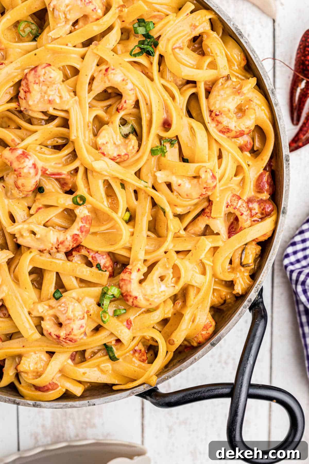 close up of a skillet of crawfish fettuccine
