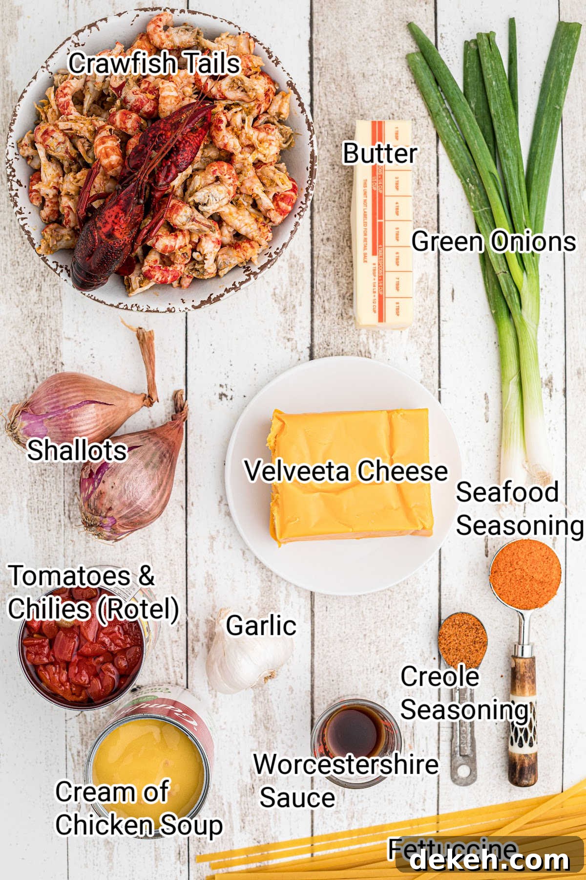 ingredients needed for a crawfish fettuccine all arranged nicely and laid out with names typed