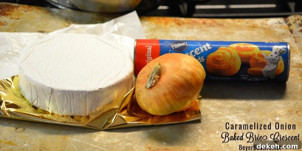 Caramelized onion baked brie crescent round is a simple combination of butter and onions browned until caramelized and piled into a brie round wrapped in crescent rounds.