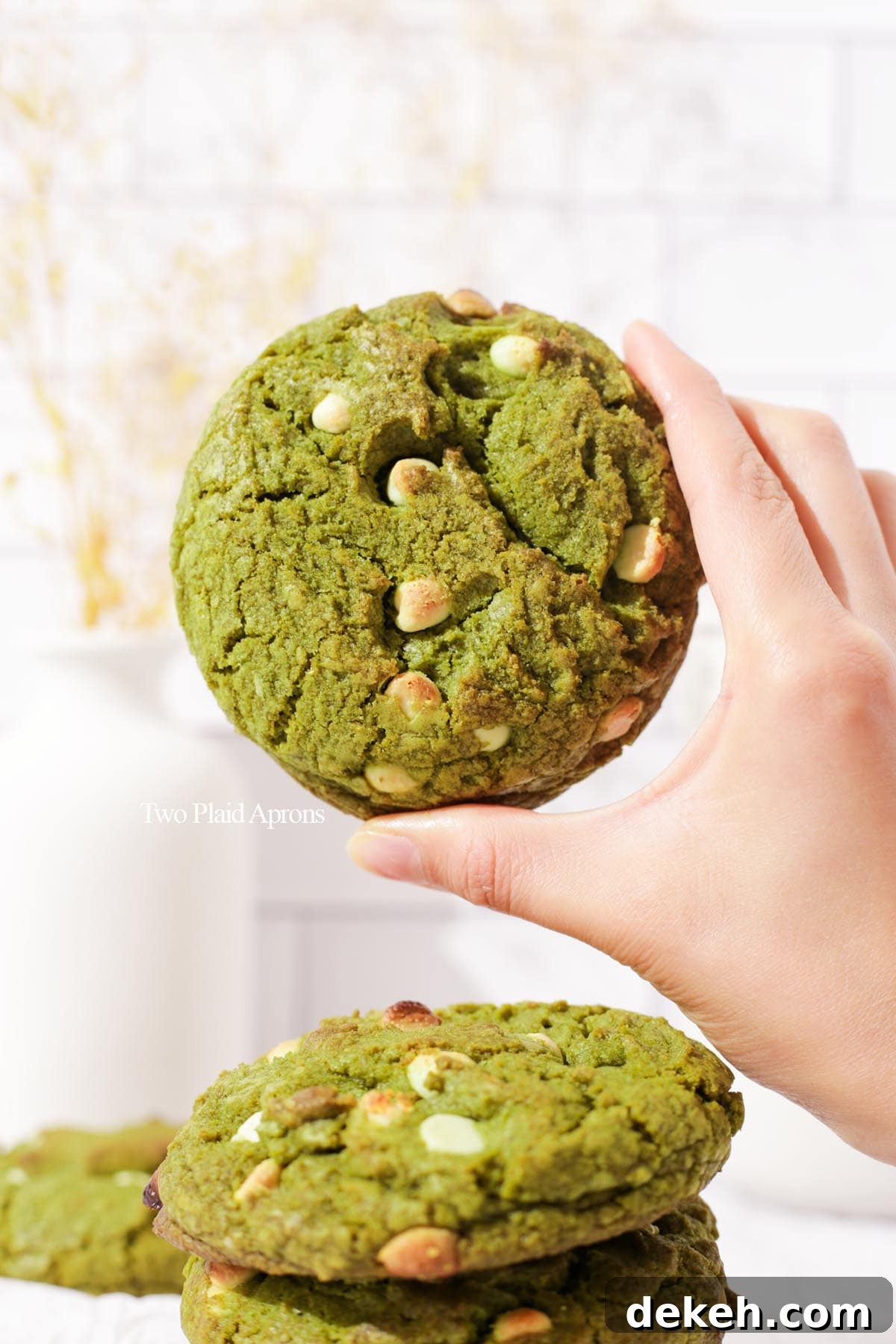 Holding the matcha white chocolate cookie.