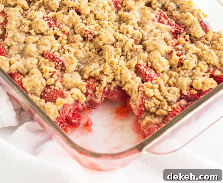 crumble in a baking pan with a scoop taken out of it