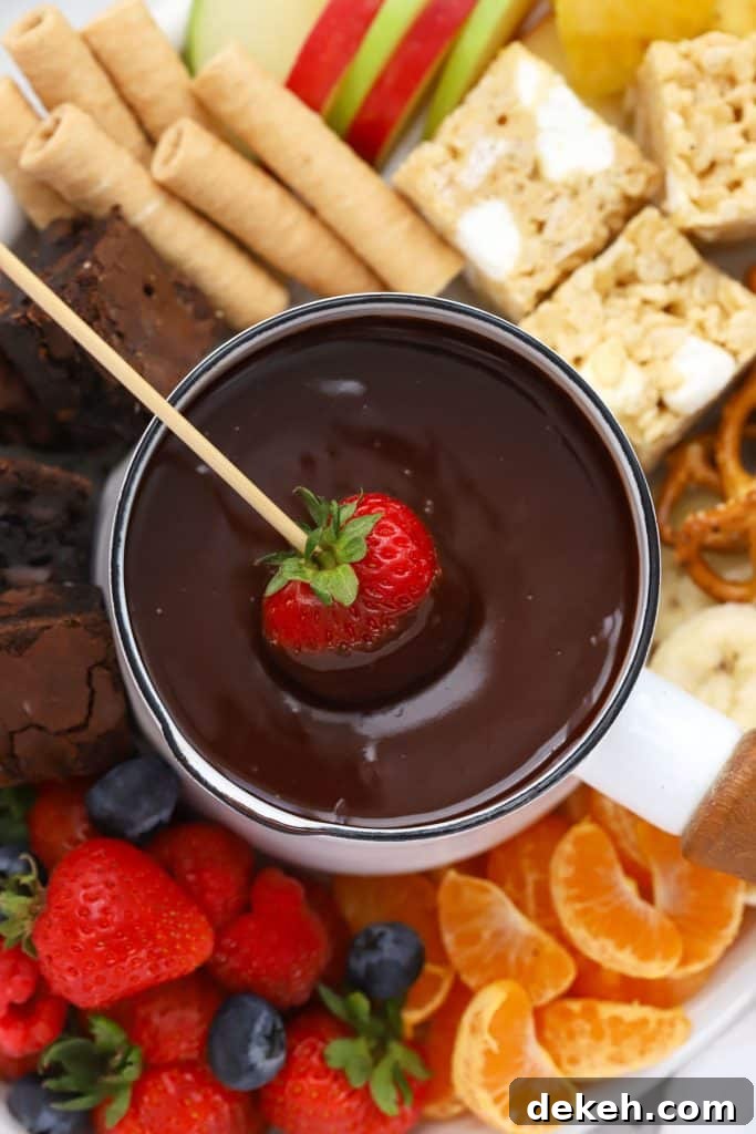 dipping a strawberry in gluten-free chocolate fondue