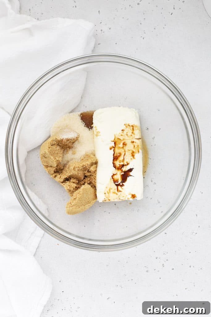 Ingredients for Brown Sugar Cream Cheese Fruit Dip in a glass mixing bowl