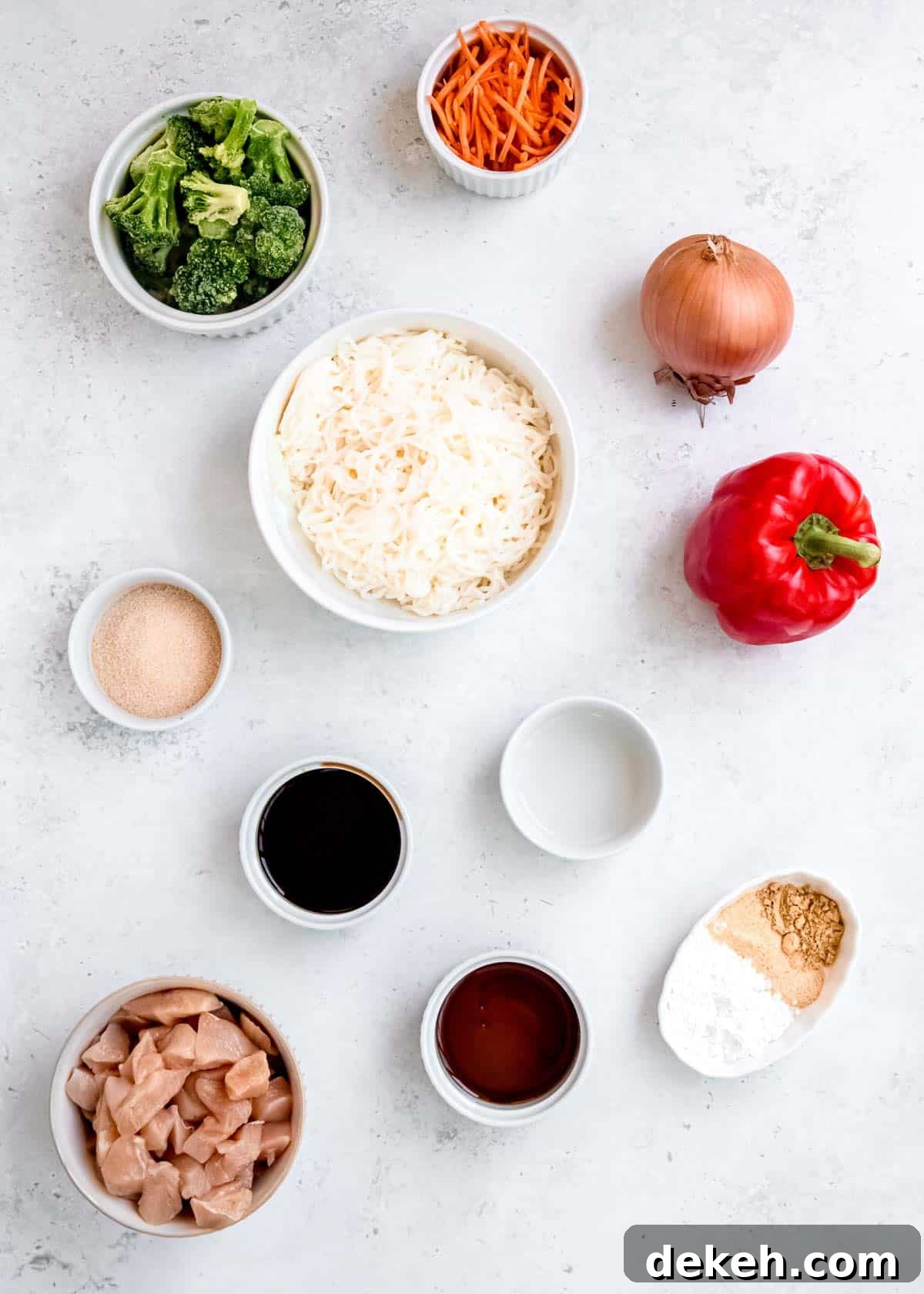 all ingredients needed for shirataki stir fry on a white background