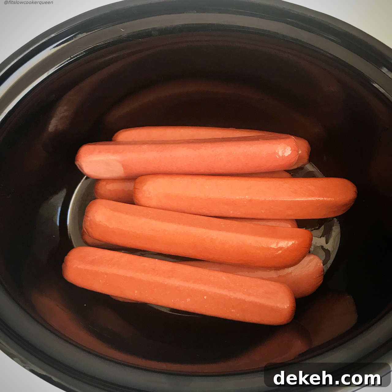 If you love steamed, 'ballpark' style hot dogs then throw them in your slow cooker! Perfect for feeding a crowd, this 1-ingredient recipe couldn't get any easier.