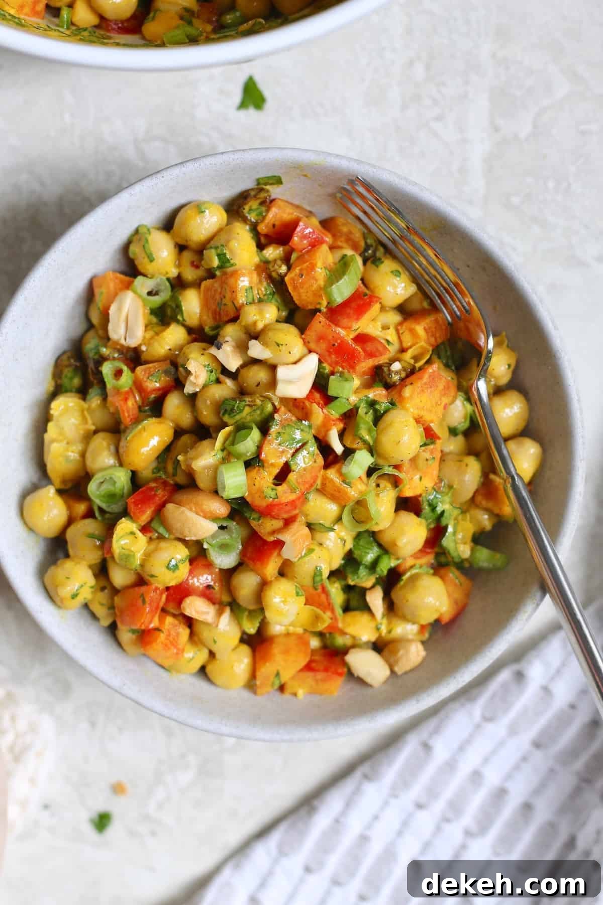 bowl of chickpea salad with spoon
