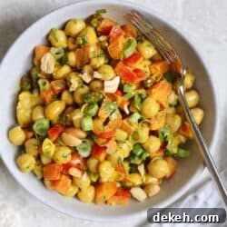 bowl of chickpea salad with spoon