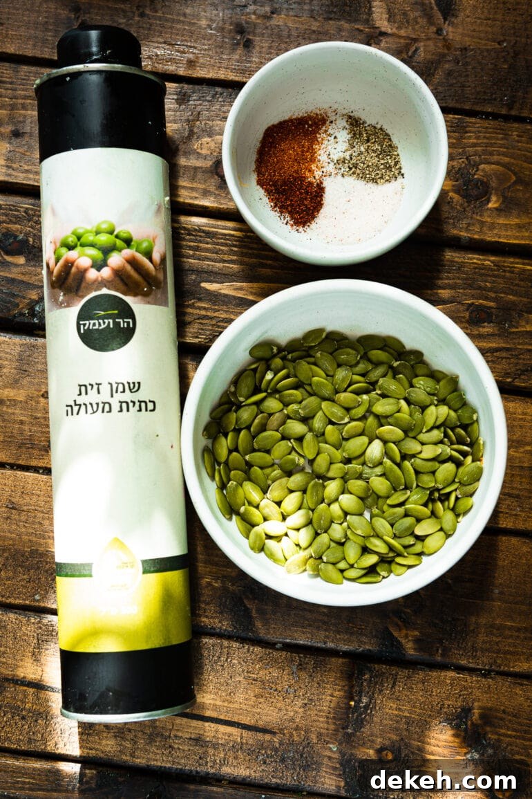 a photo of a bowl of pepitas with a container of pepitas sitting next to it.
