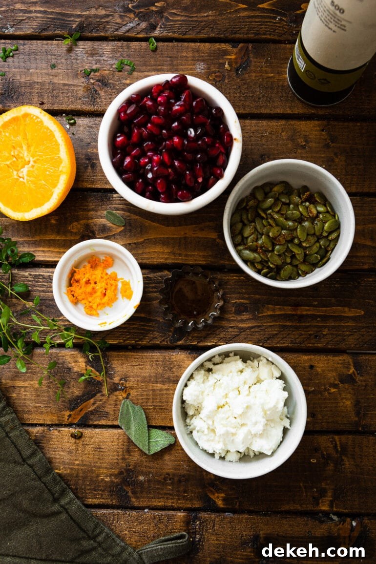 a photo of all the toppings for holiday acorn squash including pepitas, feta cheese, pomegranate seeds, and orange zest.