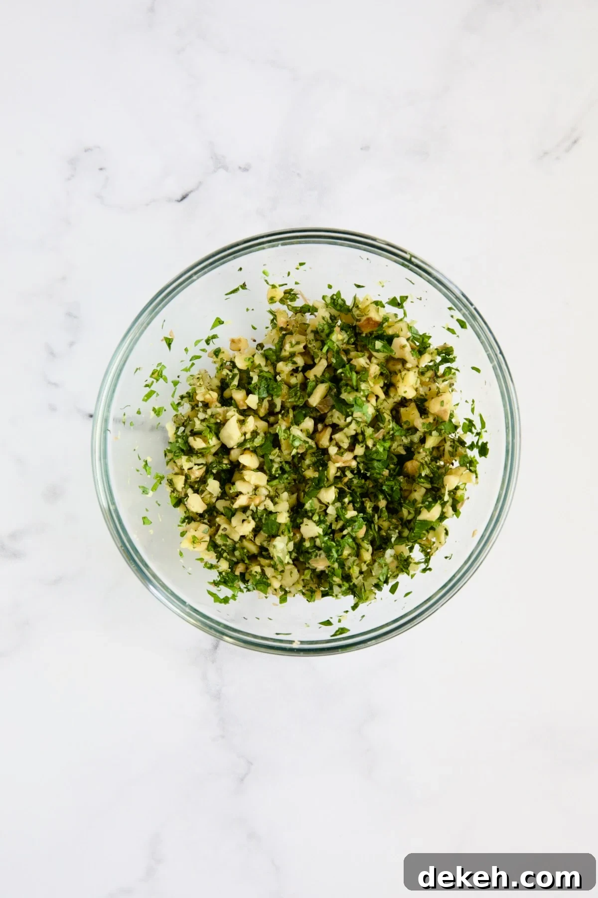 Walnut Lemon Gremolata in glass bowl.