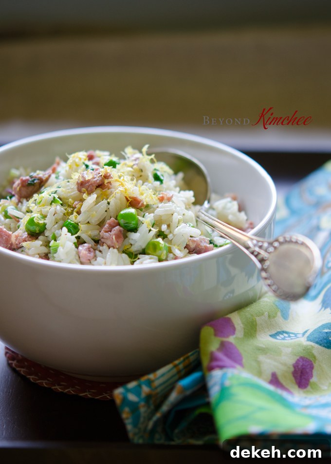 Leftover rice is stir-fried with sausage, peas, and lemon.