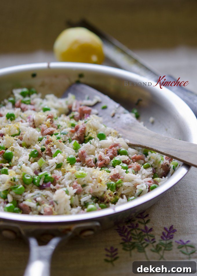 Sausage Lemon Rice is stir-fried in a skillet