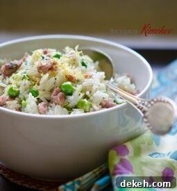 Leftover rice is stir-fried with sausage, peas, and lemon.