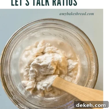 Sourdough starter being mixed in a jar.