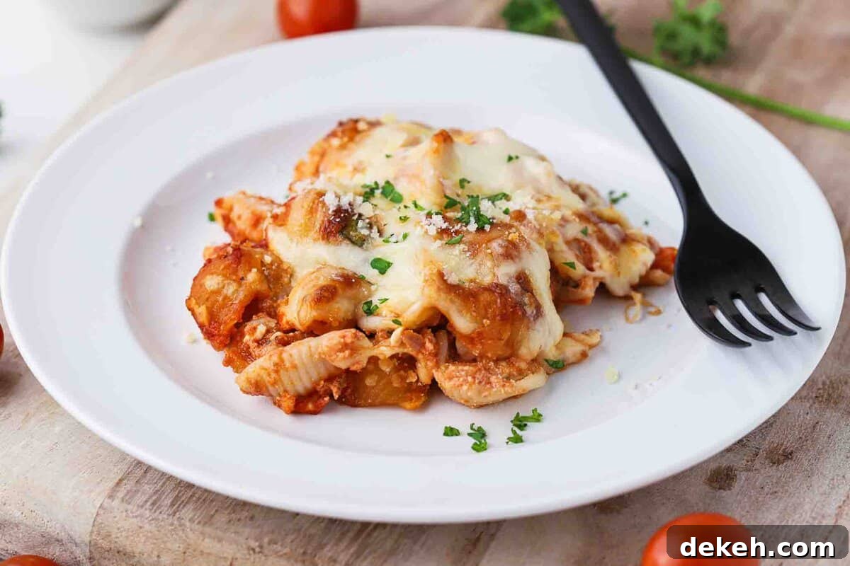 Spoonful of baked pasta on a plate.
