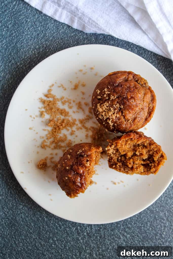 8 Popular Gluten-Free Fall Baking Recipes 5 vegan pumpkin muffins on a white plate.