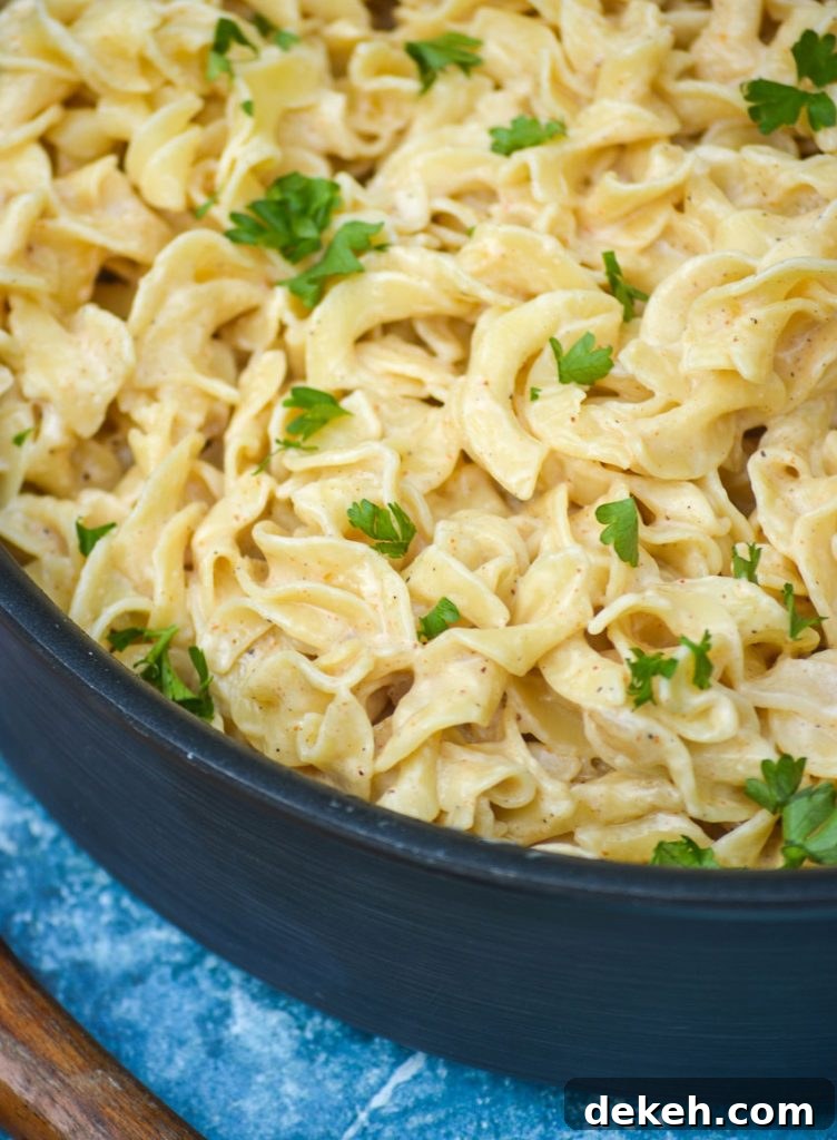 Creamy Cajun Egg Noodles Recipe with Spicy Sausage and Veggies 4 Creamy sauce over noodles