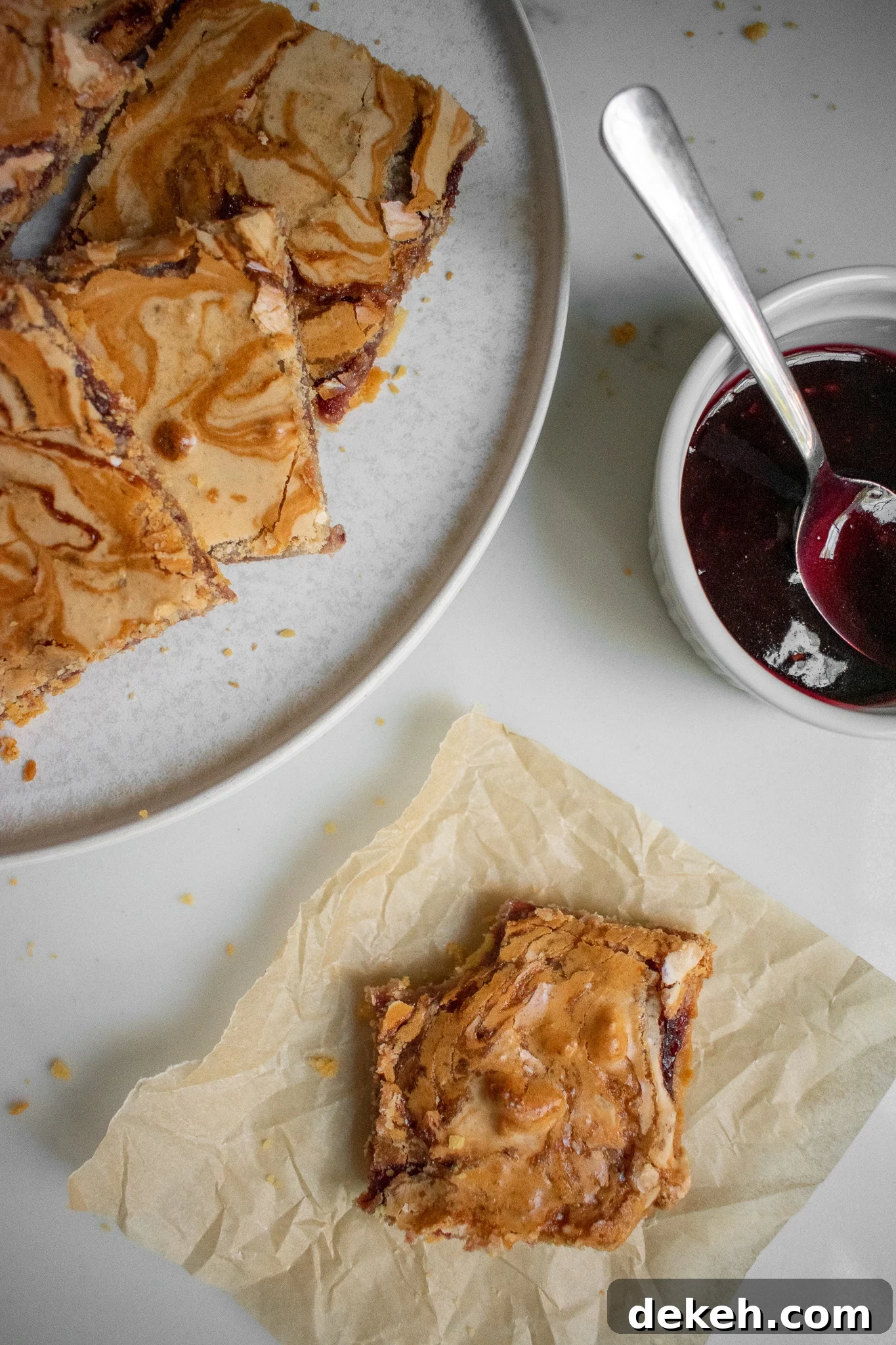 Almond and jam slices in a stack.