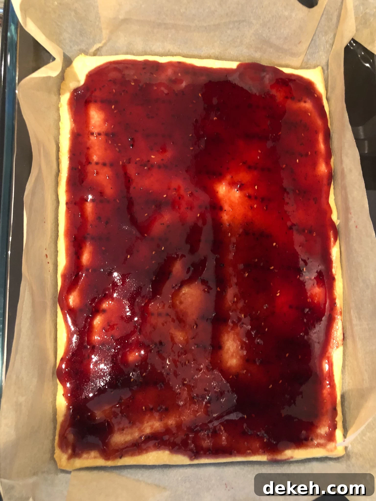 Jam spread on the baked dough.