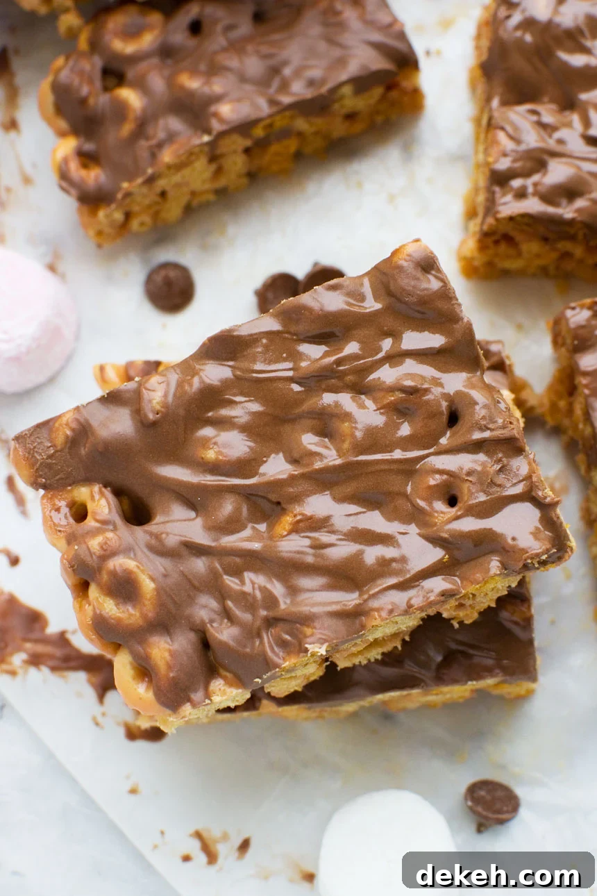 No-Bake Peanut Butter Crunch Bars — 6 Ingredients 9 Addictive peanut butter Cheerio bars stacked - image from above