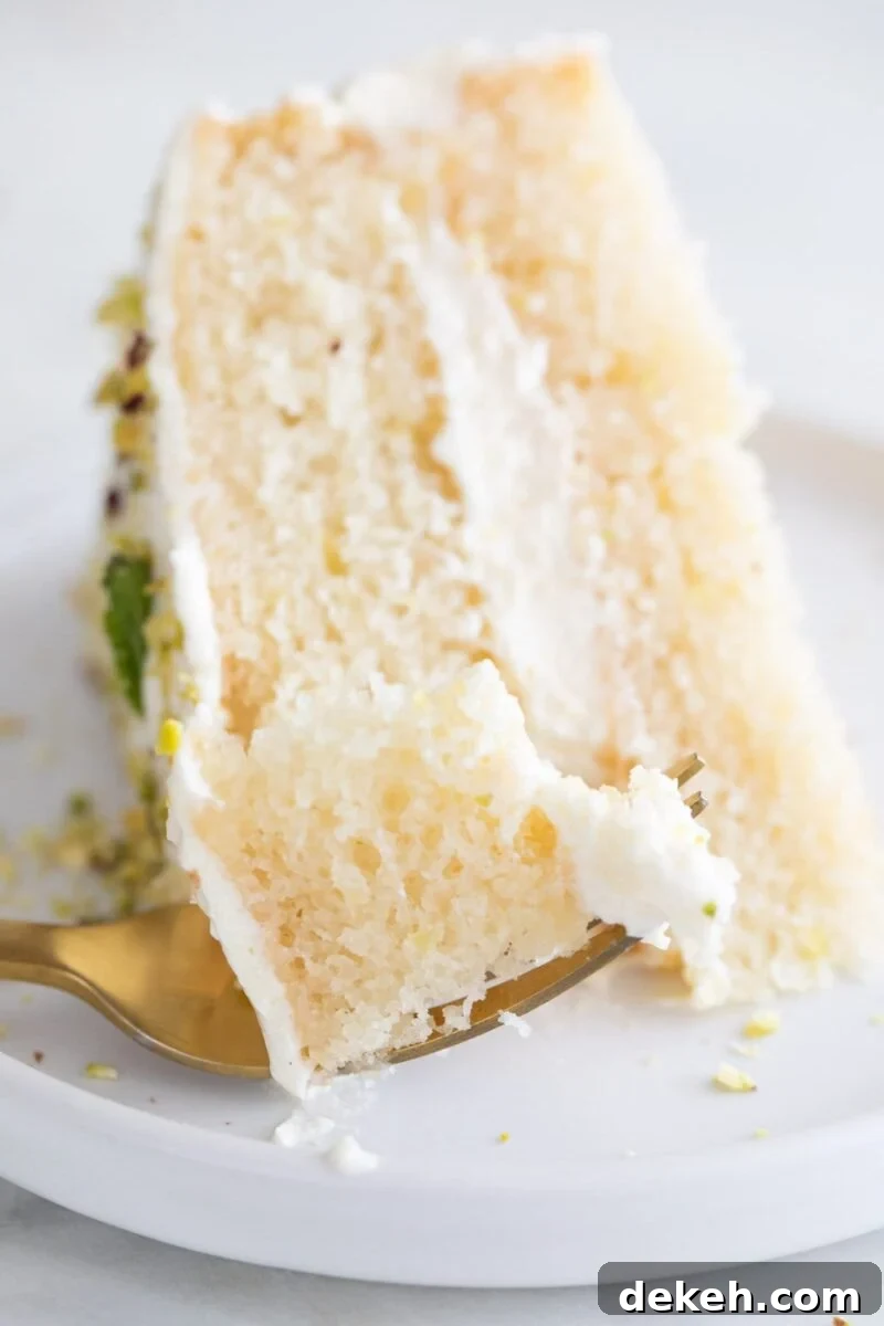 Moist Vegan Lemon Cake Recipe with Zesty Glaze 2 Close-up photo of a dish with a slice of vegan lemon cake and a fork