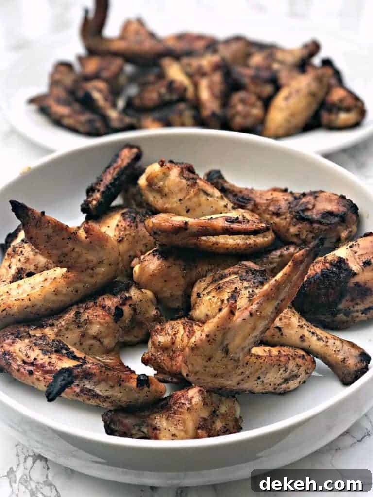 Simple BBQ Chicken Marinade Recipe for Grilled Chicken 5 grilled bbq chicken wings in a large white bowl