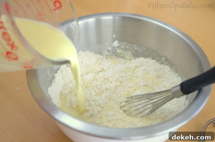Extra crispy waffles Combining Waffle Ingredients with Dry and Wet in Mixing Bowl