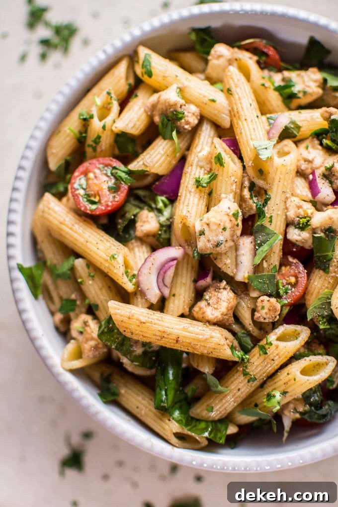 Balsamic Caprese Pasta Salad with Mozzarella and Tomatoes 3 close-up of easy Caprese pasta salad in a bowl