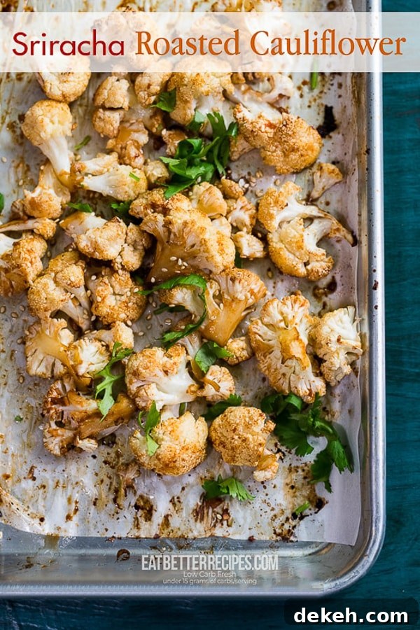 Sriracha Roasted Cauliflower Recipe Healthy Cauliflower Recipe | @eatbetterrecipes Sriracha Roasted Cauliflower on a baking sheet
