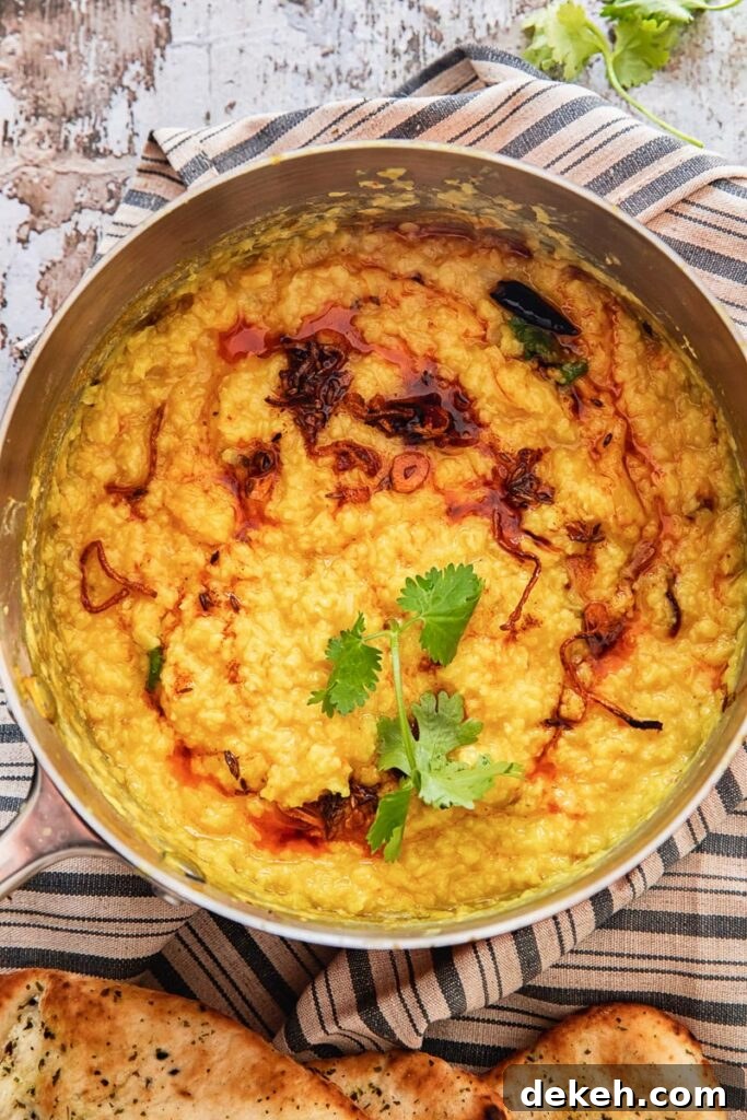 Restaurant-Style Moong Dal Tadka Recipe 6 Pot showing sauce being mixed in